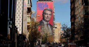 A giant electoral poster of FC Barcelona presidential hopeful Joan Laporta is seen on a building next to the Santiago Bernabeu Stadium in Madrid, Spain - December 15, 2020. REUTERS/Juan Medina